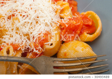 Italian snail lumaconi pasta with tomatoes Italian snail lumaconi pasta with tomatoes 30493489