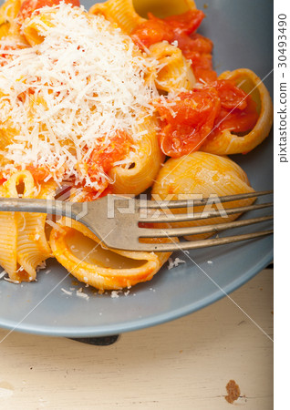 Italian snail lumaconi pasta with tomatoes 30493490