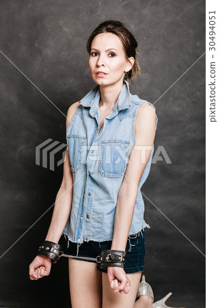 Arrest and jail. Criminal woman prisoner girl in handcuffs Arrest and jail. Criminal woman prisoner girl in handcuffs 30494051