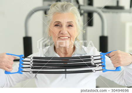 Beautiful elderly woman in a gym 30494696