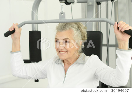 Beautiful elderly woman in a gym Beautiful elderly woman in a gym 30494697