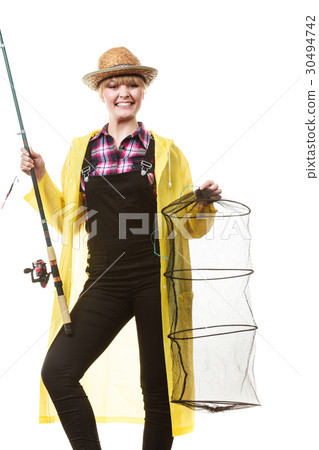 Happy woman holding fishing rod and keepnet Happy woman holding fishing rod and keepnet 30494742