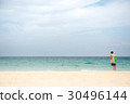 Young man listening music while enjoy sea 30496144