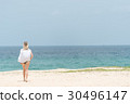 Young beautiful woman watching the sea 30496147
