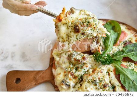 Italian pizza slice with melting cheese. 30496672