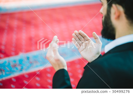 Muslim Arabic man praying Muslim Arabic man praying 30499276