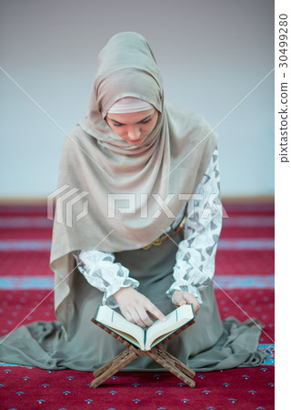 muslim woman praying in mosque muslim woman praying in mosque 30499280