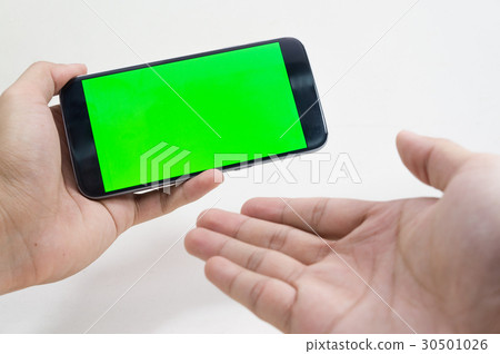 Male hand holding cell phone on white background  30501026