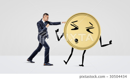A businessman throwing punches at a big 30504434