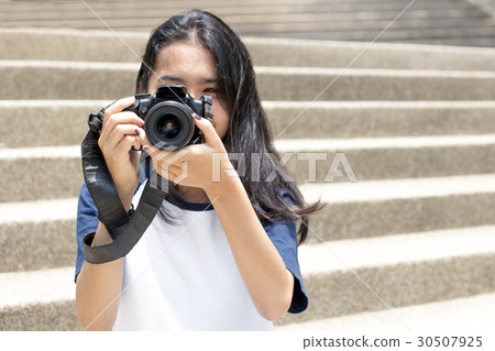 close up lens camera in asian girl hand close up lens camera in asian girl hand 30507925
