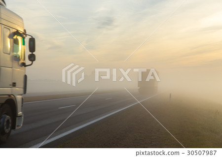 Freeway and a car in fog Freeway and a car in fog 30507987