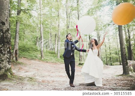 Young funny happy wedding couple outdoors with Young funny happy wedding couple outdoors with 30515585