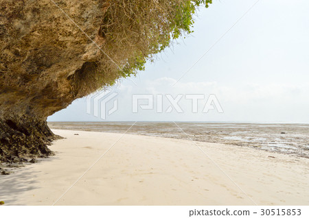 Small cove with a rock on the white sand Small cove with a rock on the white sand 30515853