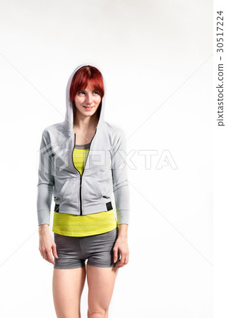 Attractive young fitness woman in gray sweatshirt Attractive young fitness woman in gray sweatshirt 30517224