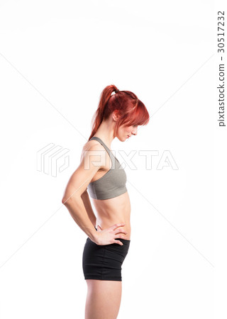 Attractive young fitness woman in sports bra 30517232