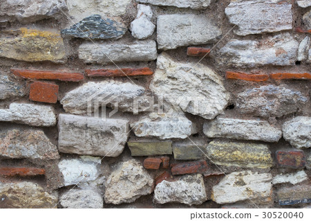 Background of an old stone brick wall close-up Background of an old stone brick wall close-up 30520040