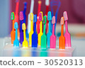Toothbrushes of different colors 30520313