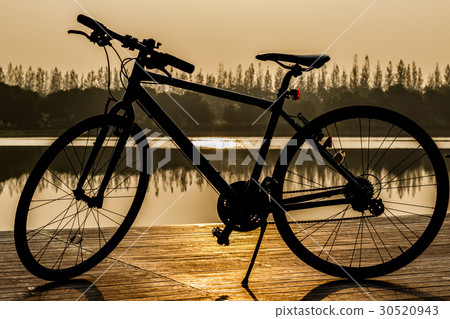 silhouette of bicycle and Sunset on beautiful sky silhouette of bicycle and Sunset on beautiful sky 30520943