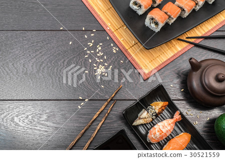 Sushi set sashimi and rolls on dark background 30521559