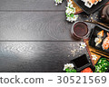 Sushi set sashimi and sushi rolls and flowers 30521569