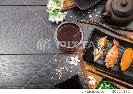 Sushi set sashimi and sushi rolls and flowers 30521572