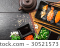 Sushi set sashimi and sushi rolls and flowers 30521573