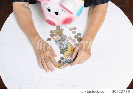 elderly woman has little money 30522789