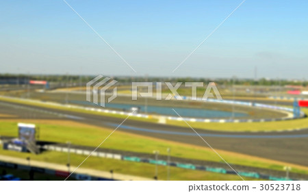 blurry picture car racing track 30523718