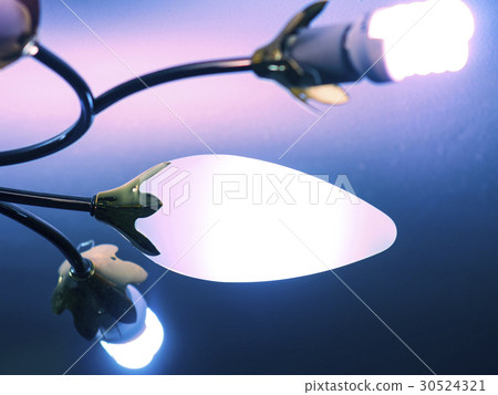 Modern glowing chandelier near the ceiling 30524321