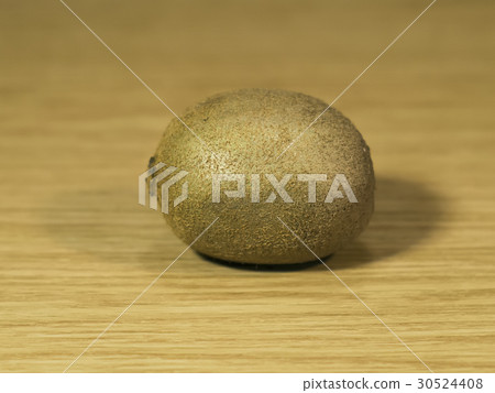 Fresh kiwi on a wooden surface Fresh kiwi on a wooden surface 30524408