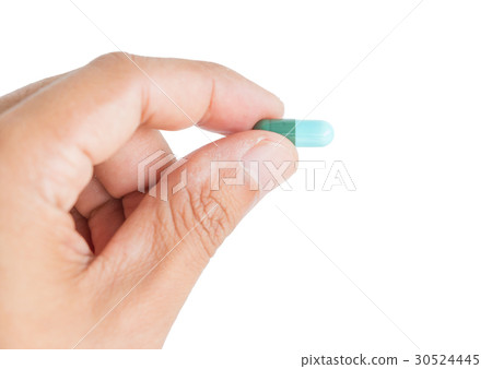 Close up hand holding pill Close up hand holding pill 30524445