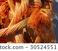 bright orange rope strangely intertwined close up 30524551