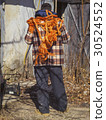 bright orange rope on a person back 30524552