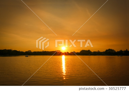 Beautiful sunset with reflection in the ocean 30525777