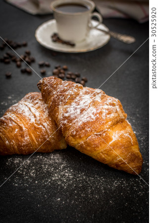 Croissant with sugar and coffee 30525920