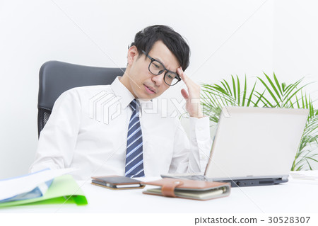 A worried, thinking businessman A worried, thinking businessman 30528307