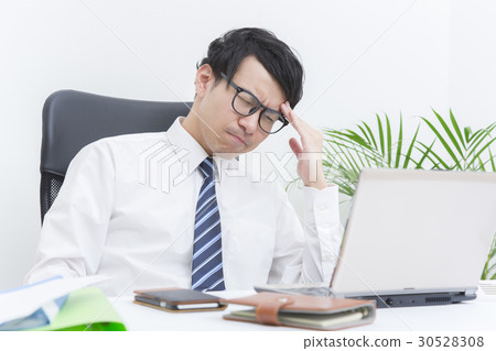 A worried, thinking businessman A worried, thinking businessman 30528308