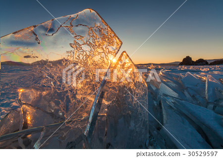 Colorful sunset over the crystal ice of Baikal 30529597