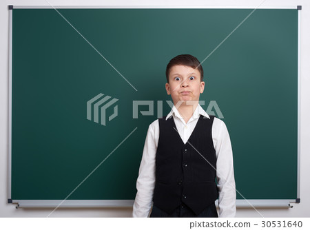 elementary school boy near blank chalkboard 30531640