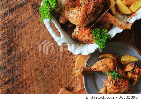 Grilled chicken leg with potato for garnish. Top Grilled chicken leg with potato for garnish. Top 30532896