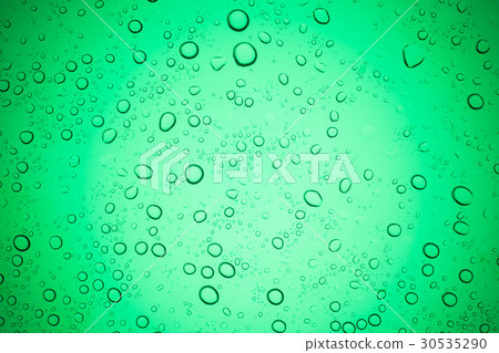 Rain droplets on green glass background. Rain droplets on green glass background. 30535290
