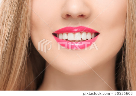 The sensual red lips, mouth open, white teeth. The sensual red lips, mouth open, white teeth. 30535603