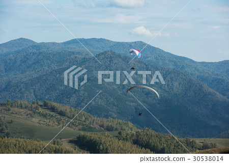 Paragliding in mountains Paragliding in mountains 30538014