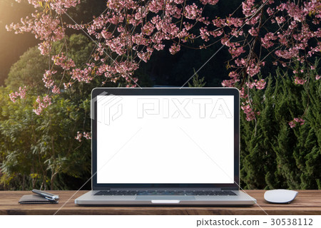 Laptop with blank screen on table Laptop with blank screen on table 30538112