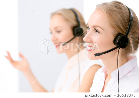 Call center. Focus on beautiful blonde woman in Call center. Focus on beautiful blonde woman in 30538373