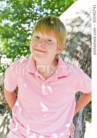Portrait of blond boy in sunlight 30540741