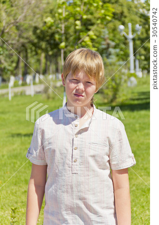 Portrait of serious boy in summer Portrait of serious boy in summer 30540742
