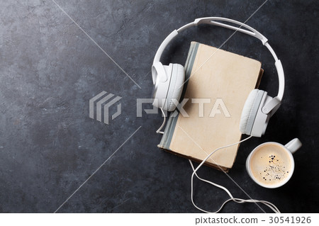 Audio book concept. Headphones, coffee and book 30541926