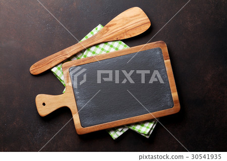 Cooking utensils on stone table Cooking utensils on stone table 30541935