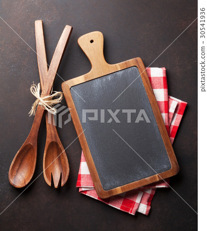 Cooking utensils on stone table Cooking utensils on stone table 30541936